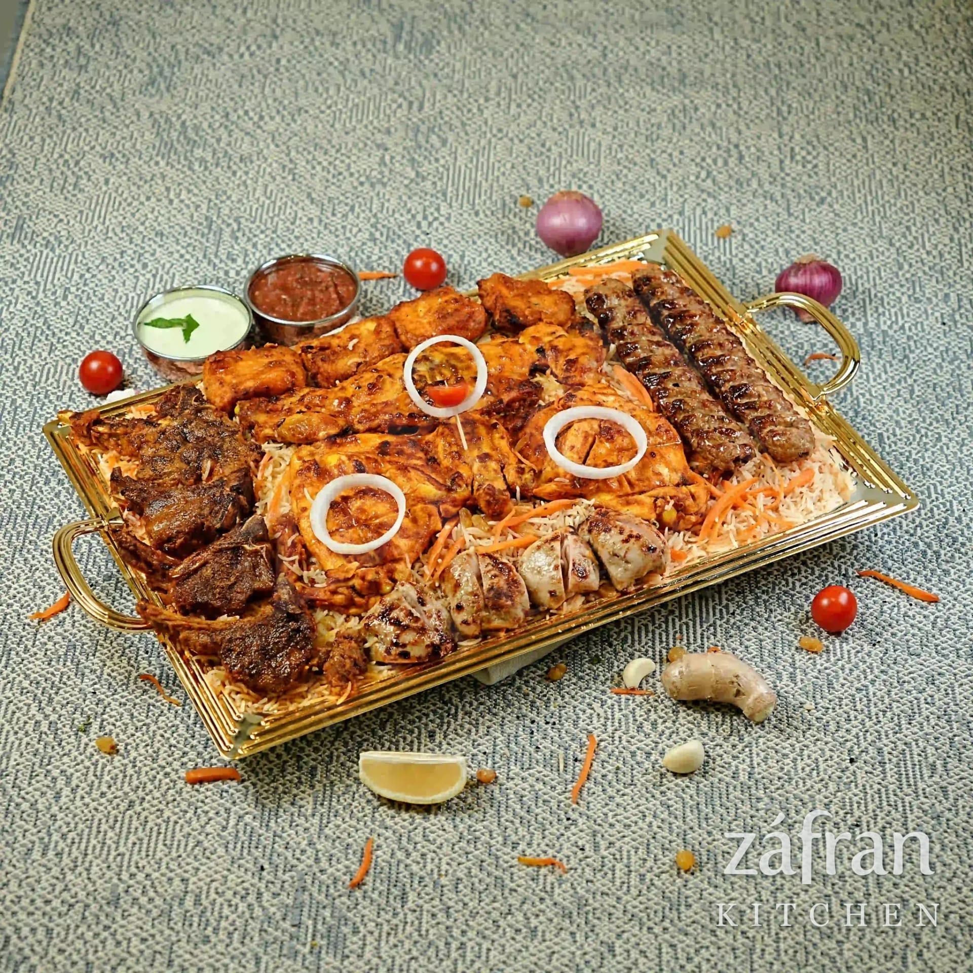 Special pulao platter with grilled meat, salad and raita at Zafran Kitchen Ajman